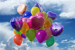 A large bunch of colorful balloons.
